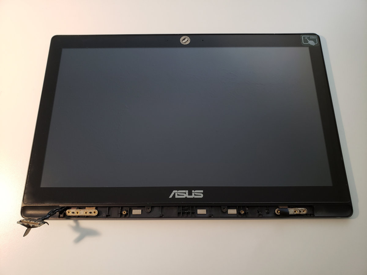 The top part with the display of Asus K550